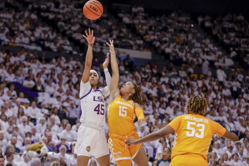 LSU guard Alexis Morris (45) shoots over Tennessee guard Jasmine Powell (15) in the first half of an NCAA college basketball game in Baton Rouge, La., Monday, Jan. 30, 2023. (AP Photo/Derick Hingle)