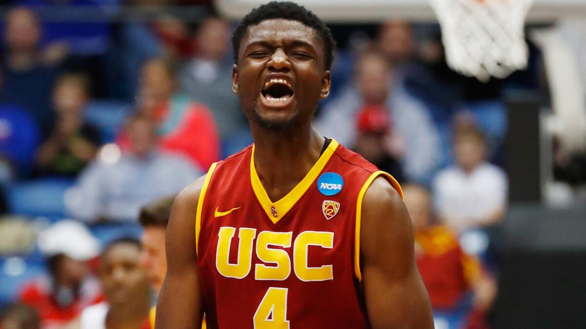 USC forward Chimezie Metu reacts after scoring on a dunk against Providence in the second half.