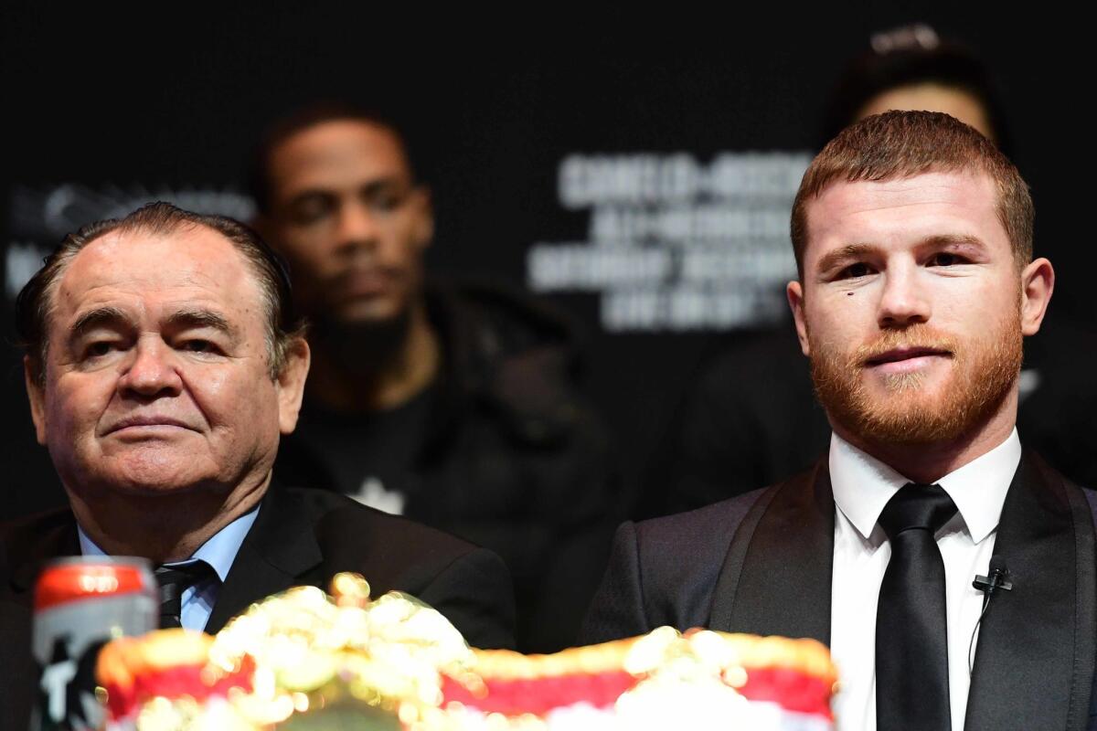 Canelo Alvarez, right, is joined by his manager, Chepo Reynoso, during a news conference at Madison Square Garden.