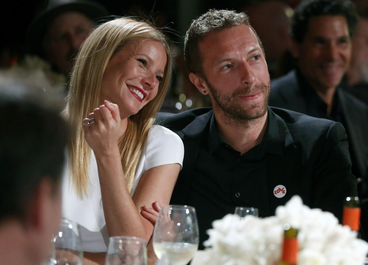 Actress Gwyneth Paltrow, left, and her husband, singer Chris Martin, attend the Sean Penn & Friends Help Haiti Home Gala in Beverly Hills on Jan. 11. Paltrow and Martin are separating after 11 years of marriage.