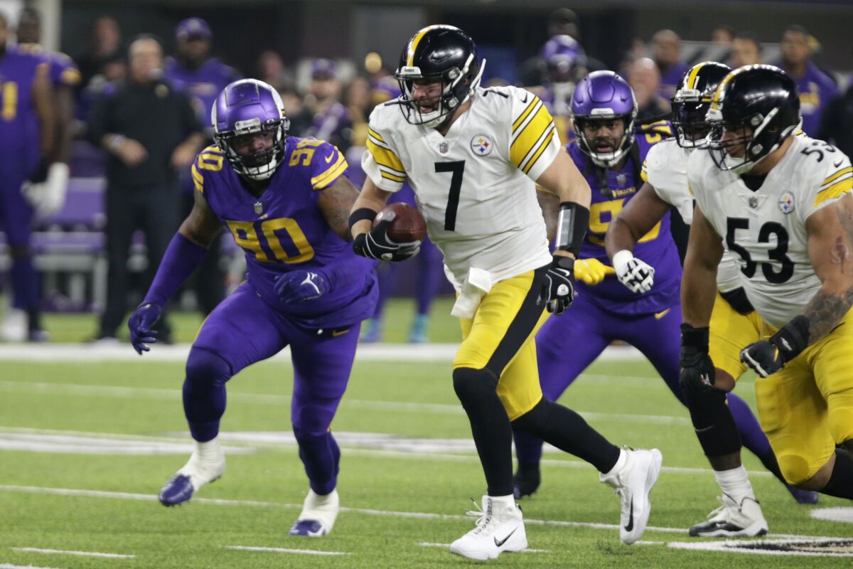 Pittsburgh Steelers quarterback Ben Roethlisberger (7) runs from Minnesota Vikings defensive tackle Sheldon Richardson (90) during the first half of an NFL football game, Thursday, Dec. 9, 2021, in Minneapolis. (AP Photo/Andy Clayton-King)