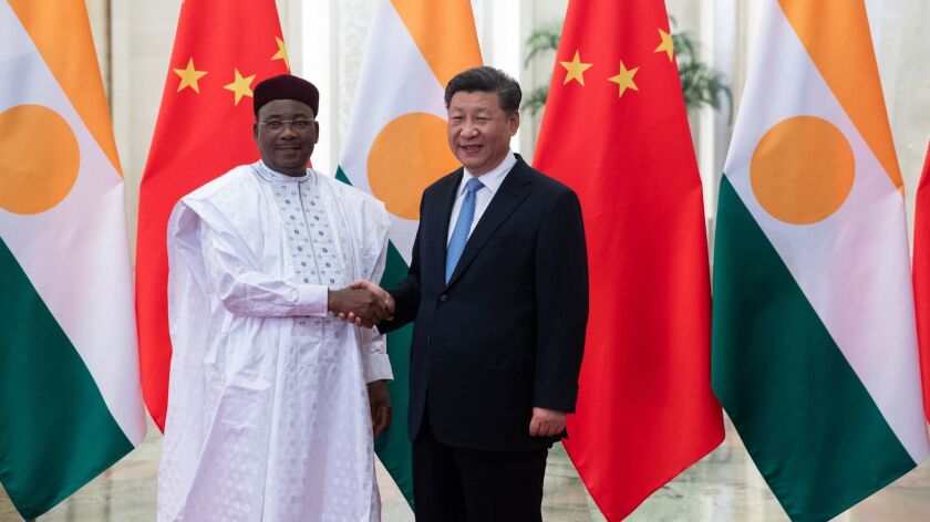 Chinese President Xi Jinping, right, and Mahamadou Issoufou, the president of Niger, meet in Beijing on Aug. 31. Issoufou is in China for the Forum on China-Africa Cooperation, starting Monday.