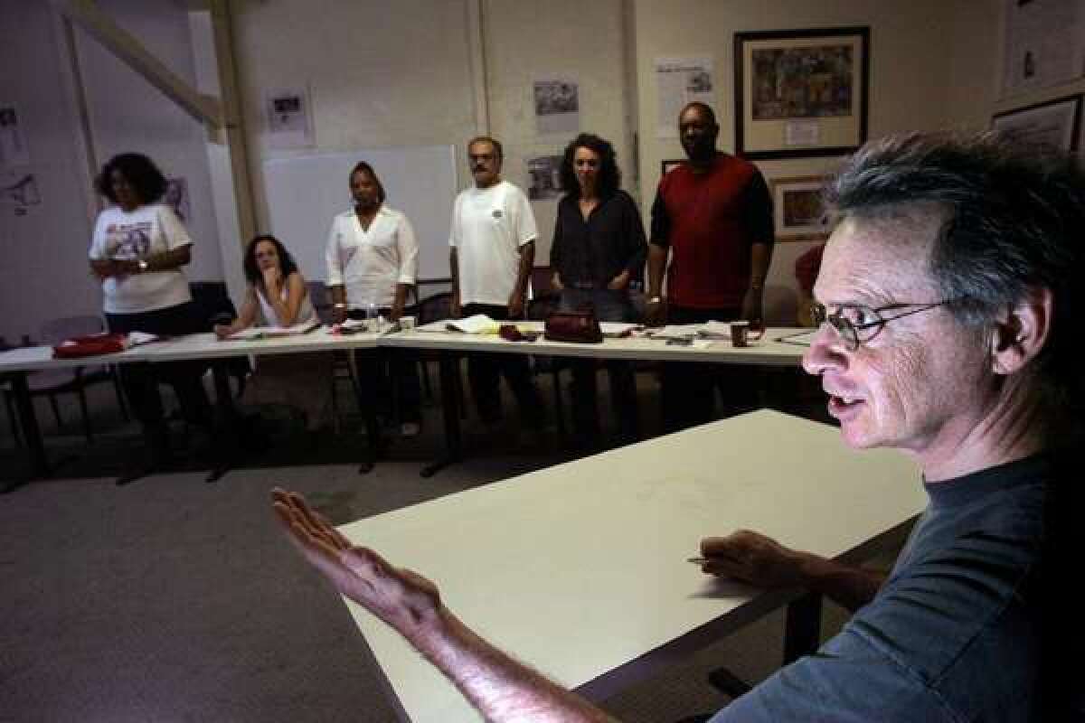 John Malpede, founder of Los Angeles Poverty Department, directs actors in a rehearsal in 2005.