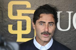 San Diego Padres general manager A.J. Preller answers questions before an Opening Day baseball game between the San Francisco Giants and the San Diego Padres, Thursday, March 28, 2024, in San Diego. (AP Photo/Denis Poroy)