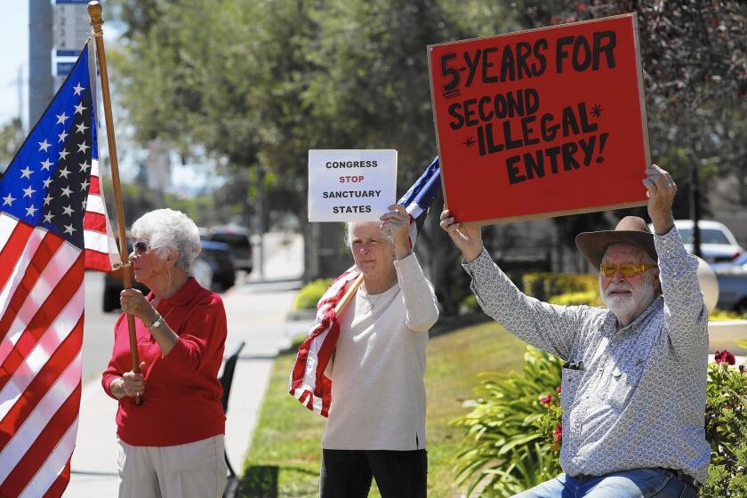 Protestors wanting illegal immigrants deported demonstrate near the Santa Maria Courthouse on Aug. 13.