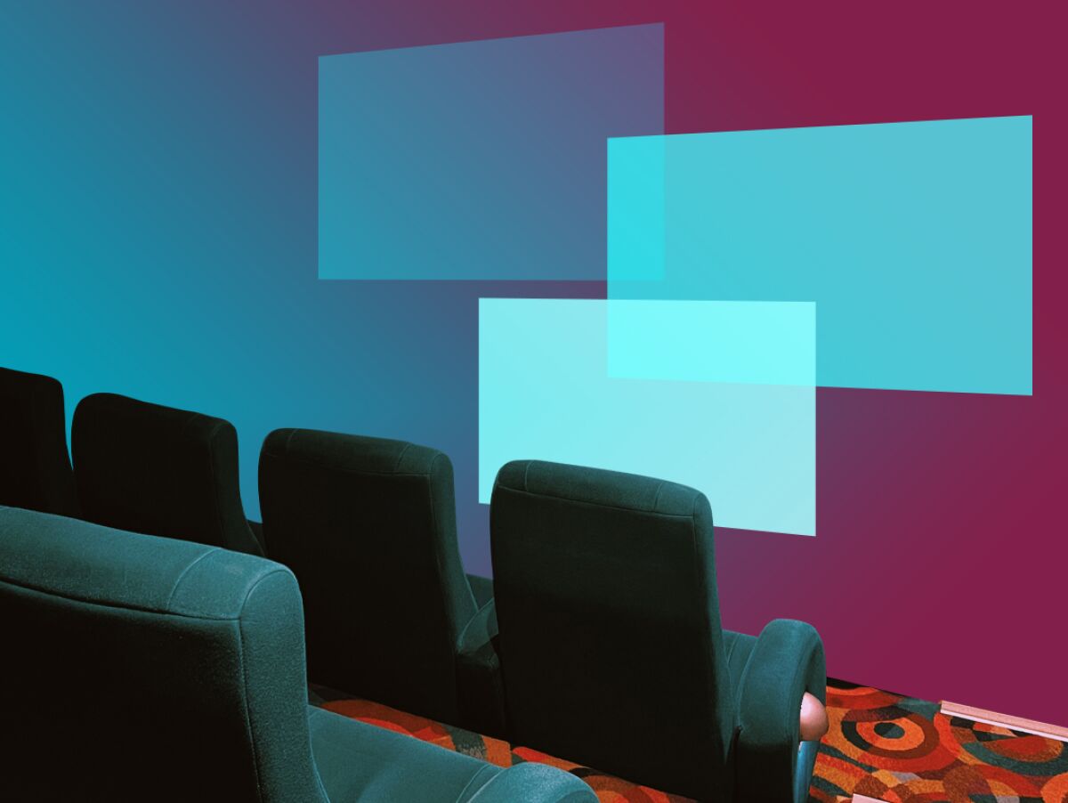 movie theater seats in front of three layers of screens