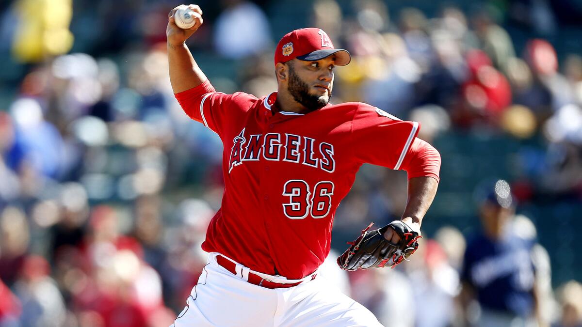 Angels pitcher Yusmeiro Petit delivers a pitch in a spring training game against the Milwaukee Brewers at Tempe Diablo stadium in Tempe, Ariz. on Feb. 25.