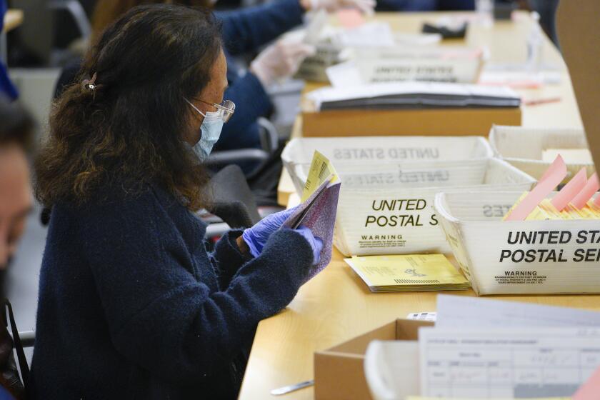 San Diego, CA - March 05: On Tuesday, March 5, 2024, at the Registrar’s Office in Kearny Mesa, workers opened mail in ballots for the 2024 Primary Election. (Nelvin C. Cepeda / The San Diego Union-Tribune)
