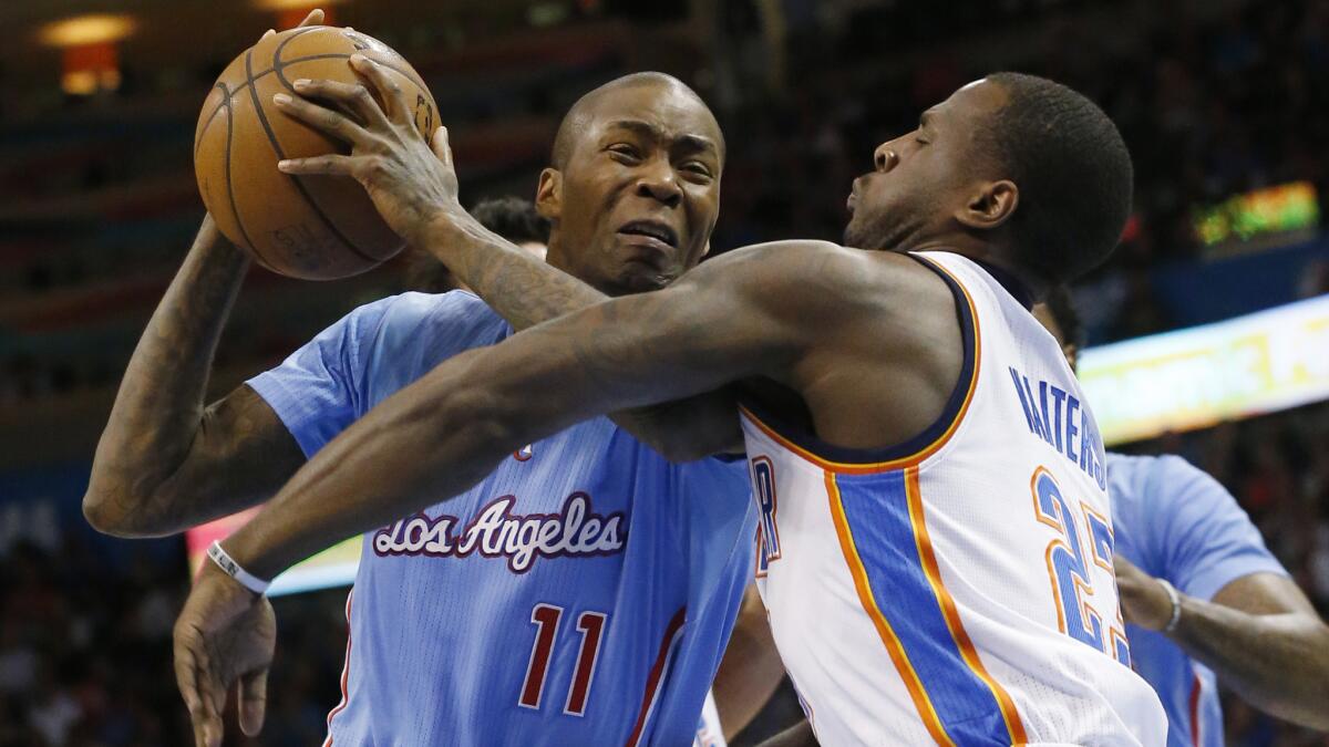 Clippers guard Jamal Crawford tries to drives on Oklahoma City Thunder guard Dion Waiters during the first half of the Clippers' 131-108 loss on Feb. 8.
