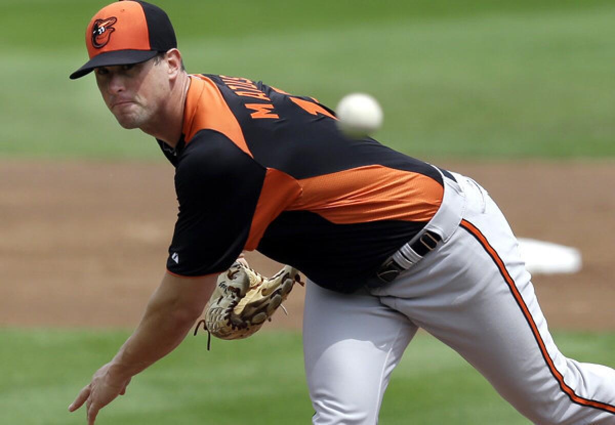 Orioles starter Brian Matusz delivers a pitch against the Red Sox during a spring training game.