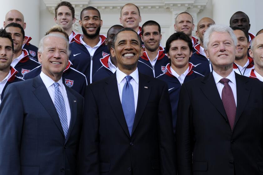 FILE - President Barack Obama, flanked by Vice President Joe Biden, left, and former President Bill Clinton, right, pose for a photo with the U.S. World Cup soccer team under the North Portico of the White House in Washington, May 27, 2010. President Joe Biden will share a stage with Barack Obama and Bill Clinton on Thursday in New York as he raises money for his reelection campaign. It's a one-of-a-kind political extravaganza that will showcase decades of Democratic leadership. (AP Photo/Susan Walsh, File)