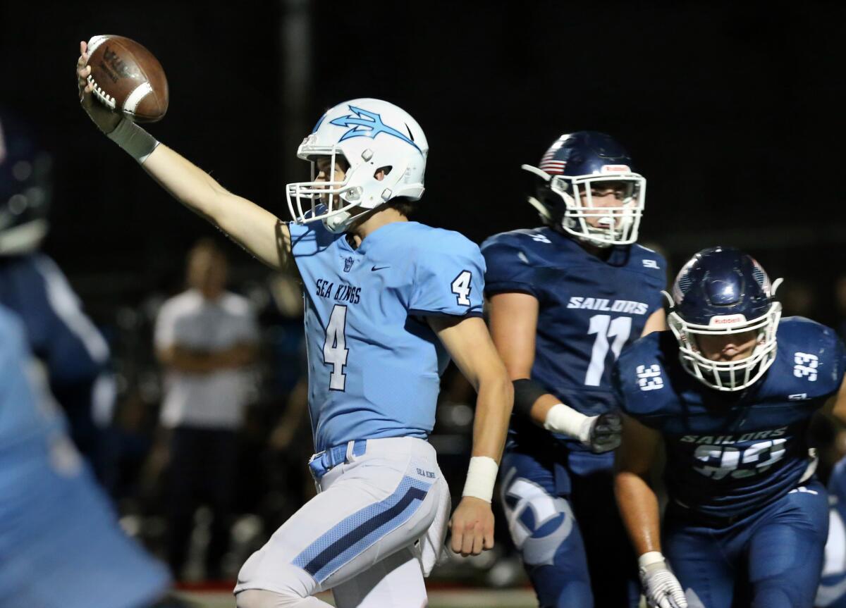 Corona del Mar quarterback Ethan Garbers runs for one of his two four-yard touchdowns in the Battle of the Bay game against Newport Harbor on Friday at Davidson Field.