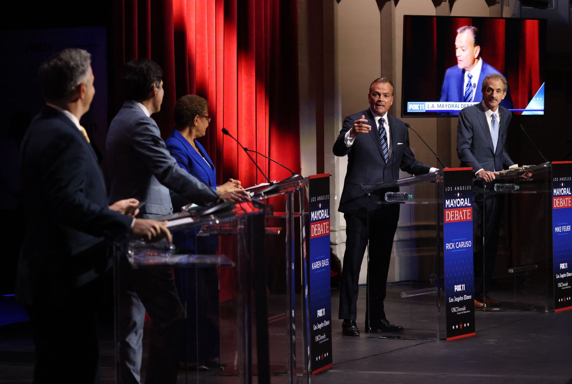 Businessman Rick Caruso, second from right, makes a rebuttal during the mayoral debate 