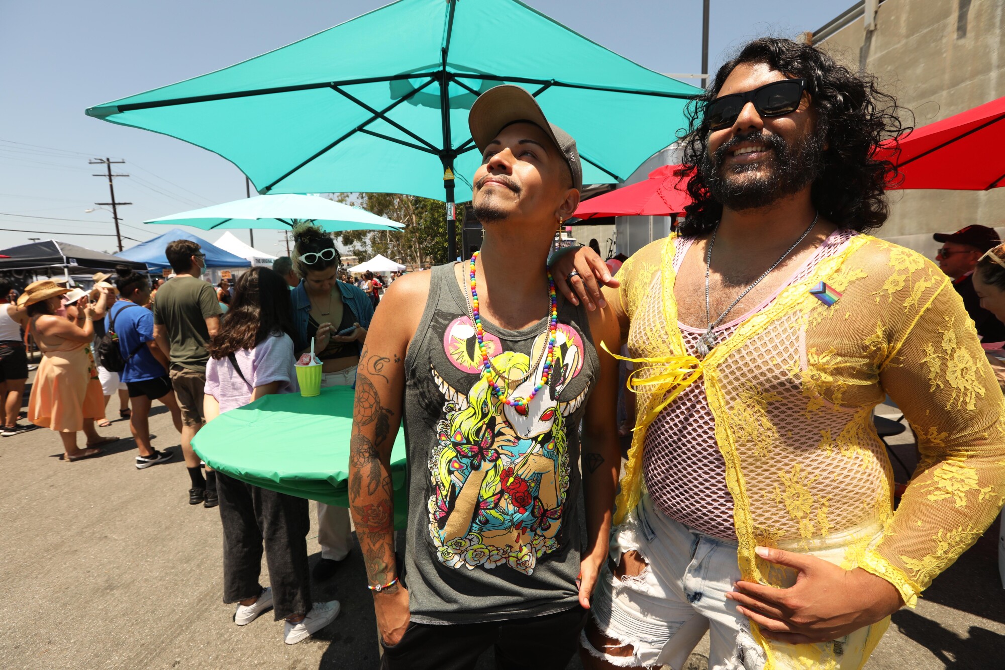 Justin Carrillo, left, and his brother William Urbina, enjoy a day at the Queer Mercado.