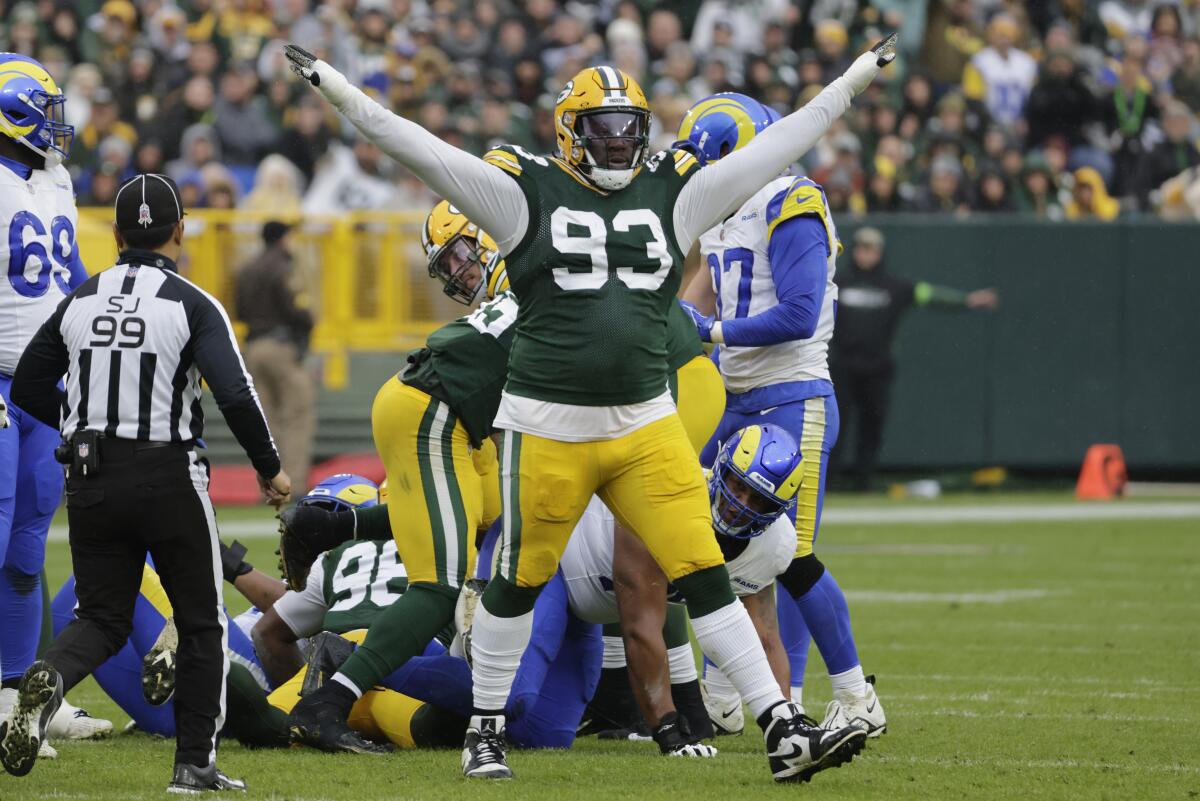 Packers defensive tackle T.J. Slaton (93) exults after a missed field-goal attempt by Rams kicker Lucas Havrisik.