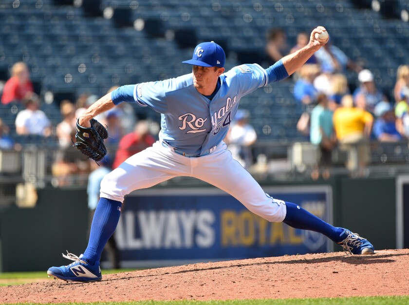 Tim Hill of the Kansas City Royals throws during game last season.