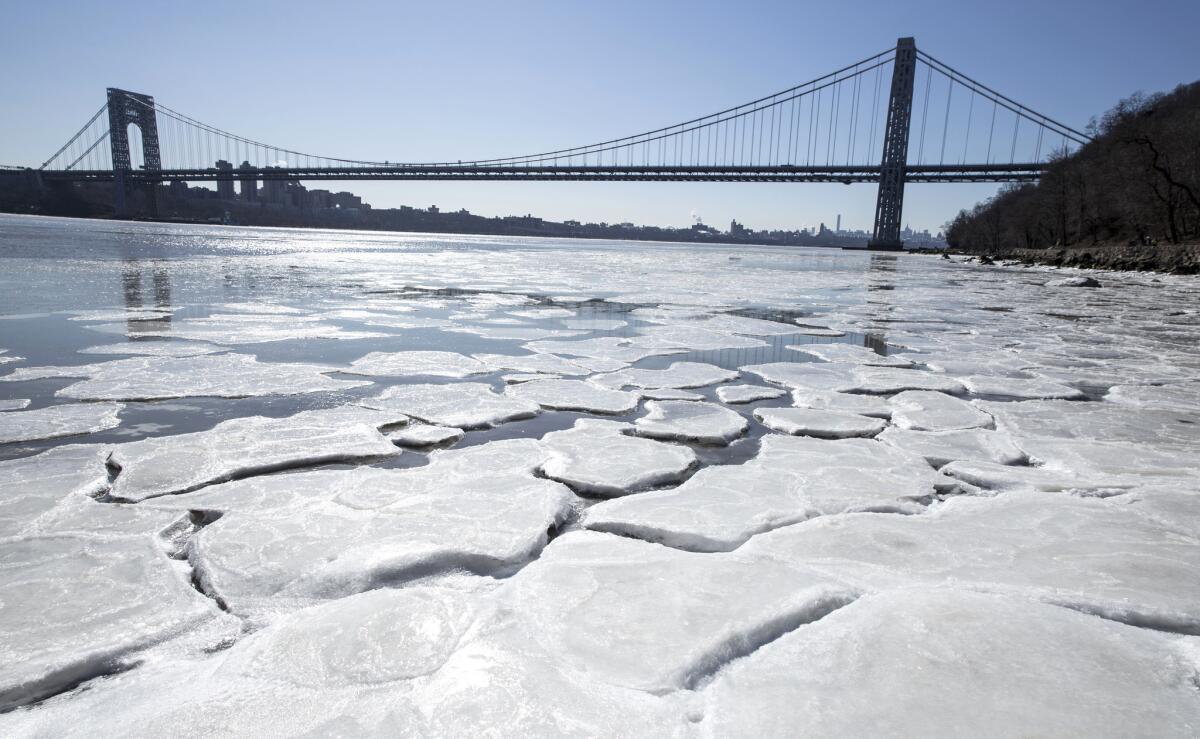 Ice begins to form on the banks of the Hudson River in Englewood Cliffs, N.J., as temperatures dove to the single digits.