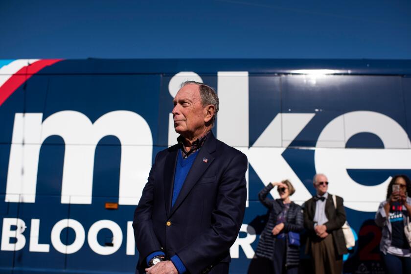 Democratic presidential candidate Mike Bloomberg waits by his tour bus ahead of adressing his supporters at Central Machine Works in Austin, Texas on January 11, 2020. - Democratic presidential candidate Mike Bloomberg kicks off his Texas bus tour. (Photo by Mark Felix / AFP) (Photo by MARK FELIX/AFP /AFP via Getty Images)