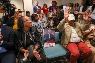 Los Angeles, CA - June 23: Community members cheer comments supporting Councilman Curren Price during City Council rules committee meeting on Friday, June 23, 2023 in Los Angeles, CA. (Brian van der Brug / Los Angeles Times)