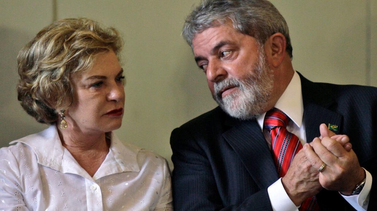 Then-President Luiz Inacio Lula da Silva talks with wife Marisa Leticia in 2008 at a ceremony in Rio de Janeiro.