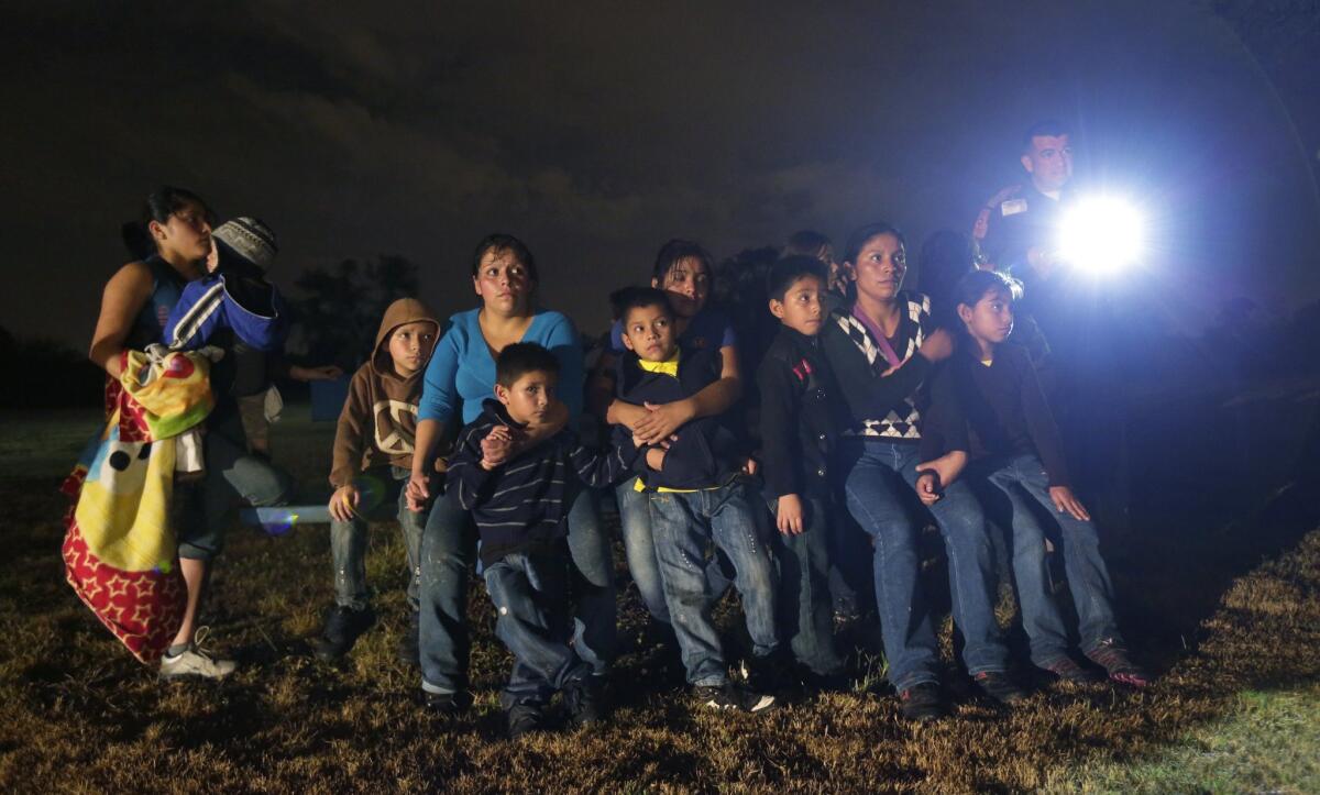 A group of immigrants from Honduras and El Salvador who crossed the U.S.-Mexico border illegally in June and were stopped in Granjeno, Texas.