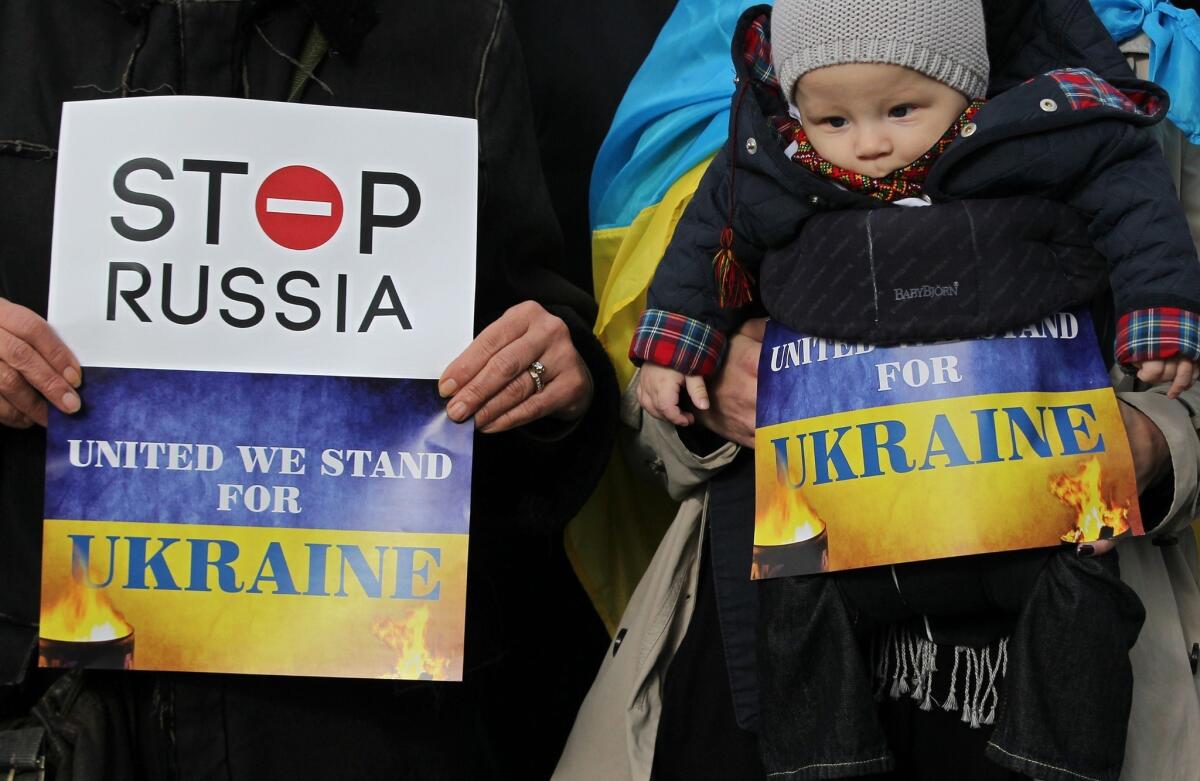 Pro-Ukrainian supporters demonstrate Thursday outside a gathering of the European Peoples Party at the Dublin Convention Center in Dublin, Ireland.