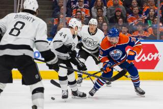 EDMONTON, AB - APRIL 24: Los Angeles Kings Defenceman Mikey Anderson (44) checks Edmonton Oilers Center Sam Carrick (39) in the first period of game two of the Western Conference First Round Edmonton Oilers game versus the Los Angeles Kings on April 24, 2024 at Rogers Place in Edmonton, AB. (Photo by Curtis Comeau/Icon Sportswire via Getty Images)