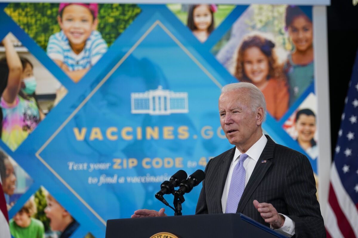 FILE - President Joe Biden talks about the newly approved COVID-19 vaccine for children ages 5-11 from the South Court Auditorium on the White House complex in Washington, Wednesday, Nov. 3, 2021. Millions of health care workers across the U.S. were supposed to have their first dose of a COVID-19 vaccine by this coming Monday, Dec. 6 under a mandate from President Joe Biden's administration. But that has been placed on hold by federal judges. (AP Photo/Susan Walsh, File)