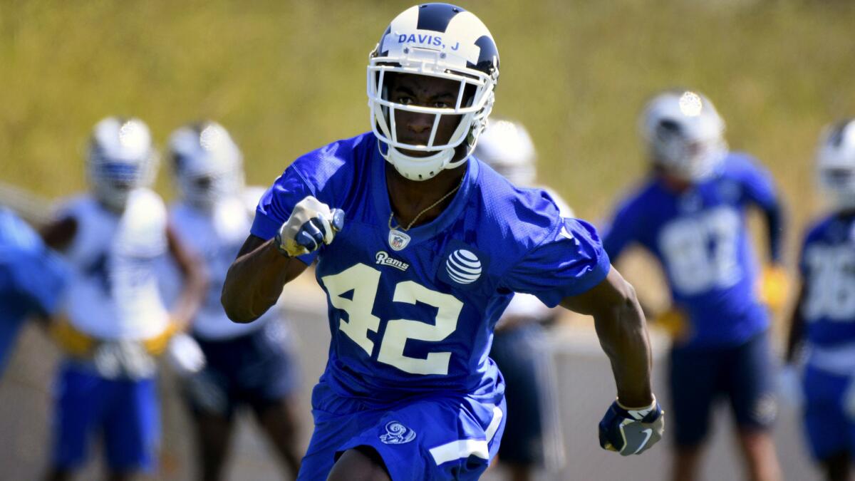Running back Justin Davis runs a drill during the Rams' rookie minicamp on Friday.