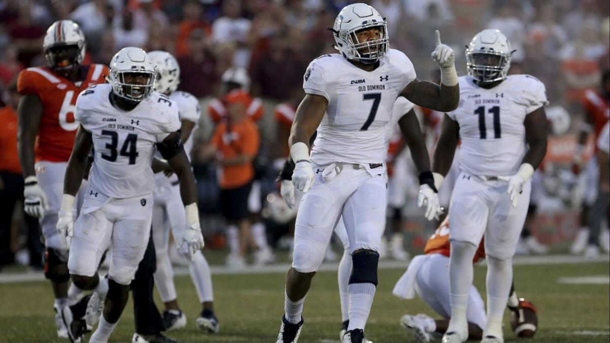 Old Dominion's Oshane Ximines reacts after a first down during the second half against Virginia Tech on Saturday.