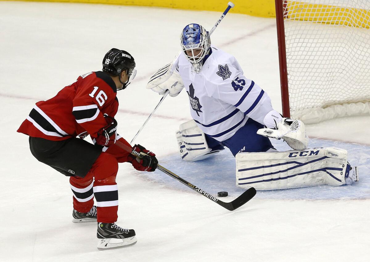 Maple Leafs goalie Jonathan Bernier tries to stop the shot of Devils center Jacob Josefson (16) during a shootouton Jan. 28, 2015.
