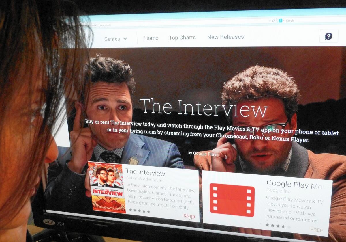 "The Interview” was streamed or downloaded more than 2 million times over the holiday weekend after it was released via video on demand on Christmas Eve, the day before it hit theaters. Above, a woman looks at a Google Play purchase page of "The Interview."