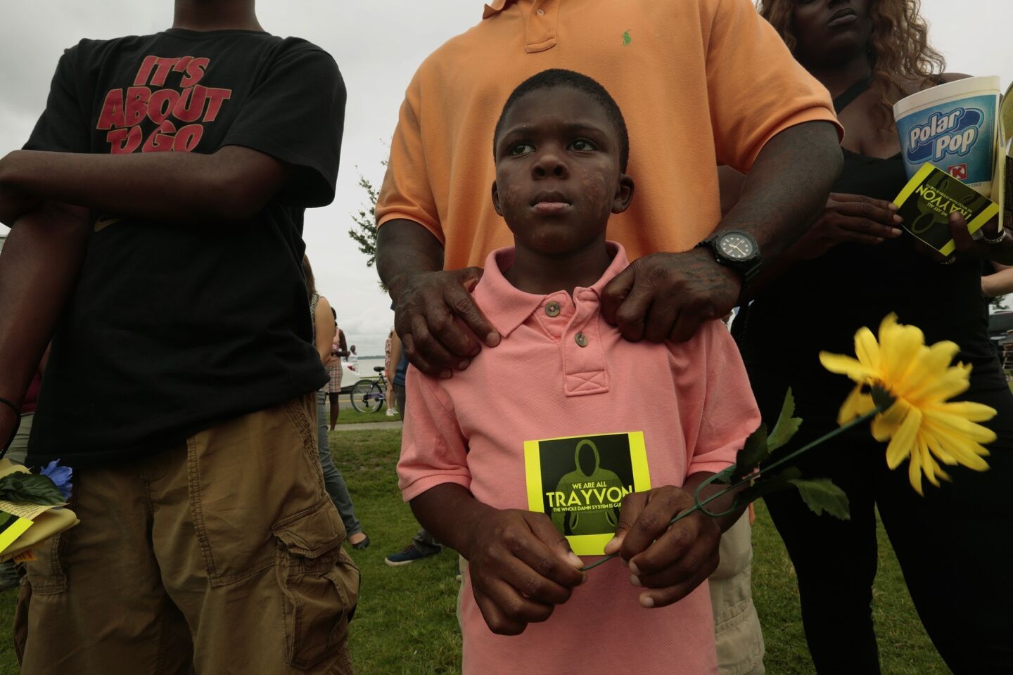 Terrance J. Smith II, 7, and is father Terrance J. Smith, of Fort Myers, Fla., attend a rally Sanford in support of Trayvon Martin.
