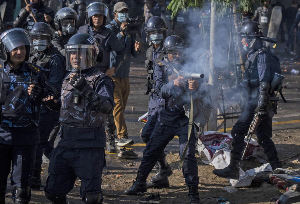 Police firing tear gas at protesters demanding restoration of Nepal's monarchy