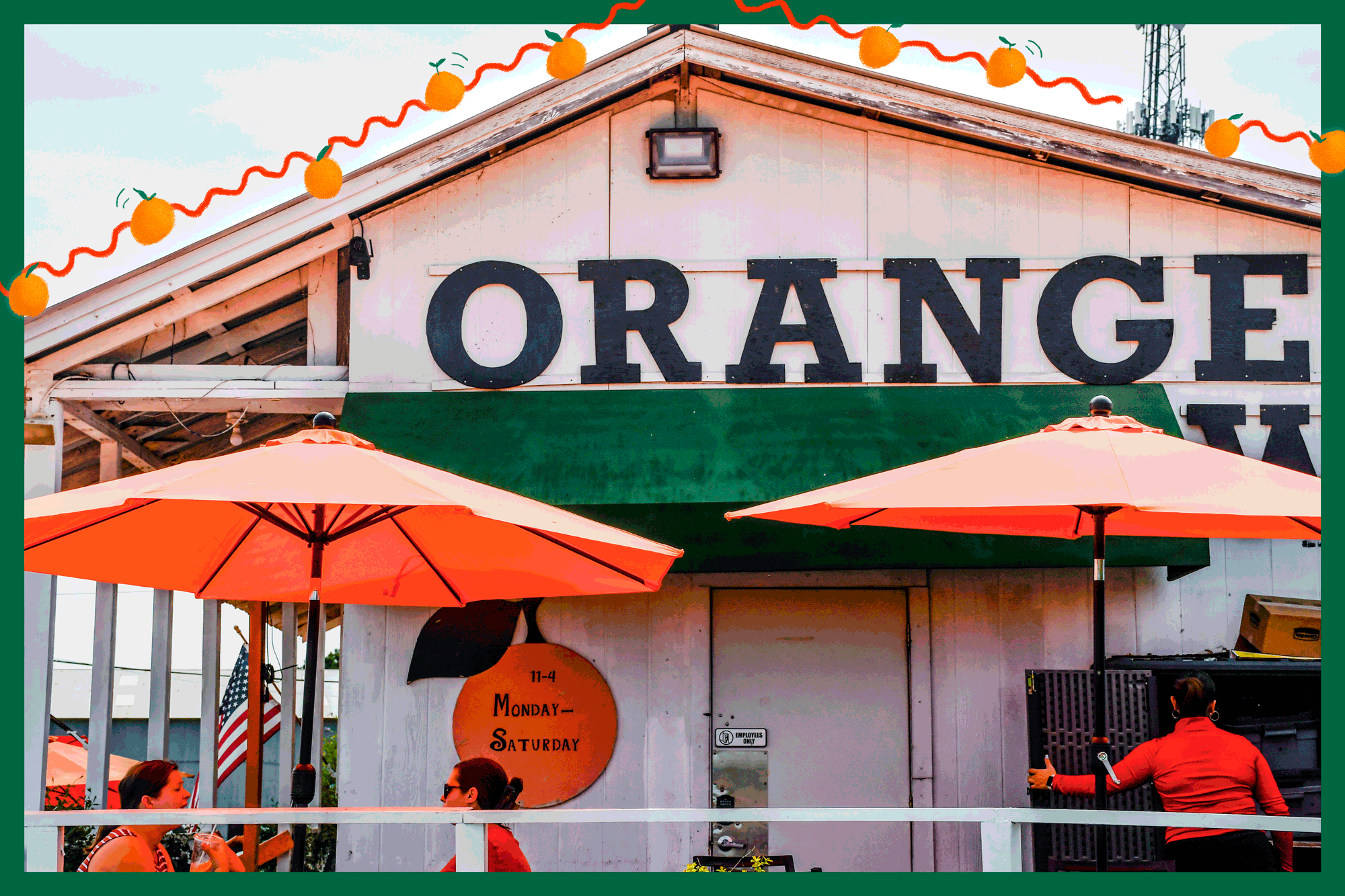 A GIF of small oranges on top of a photo of a small building with people sitting outdoors under orange umbrellas.