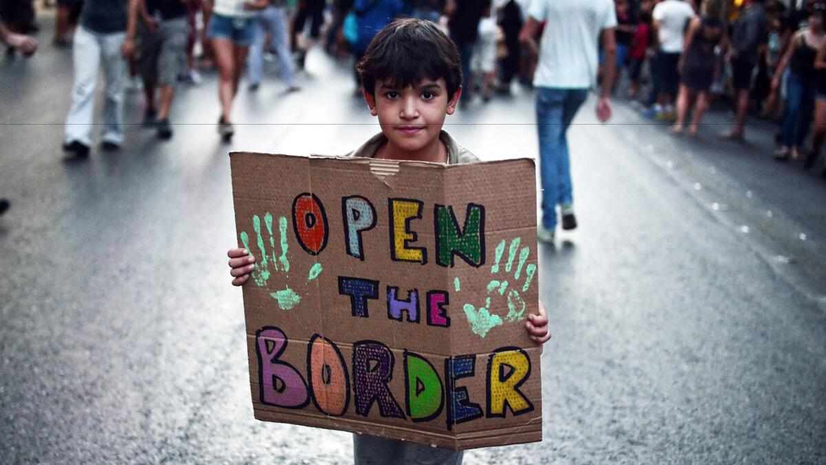 A child shares his sentiments during a demonstration in Athens in August to support refugees and migrants.