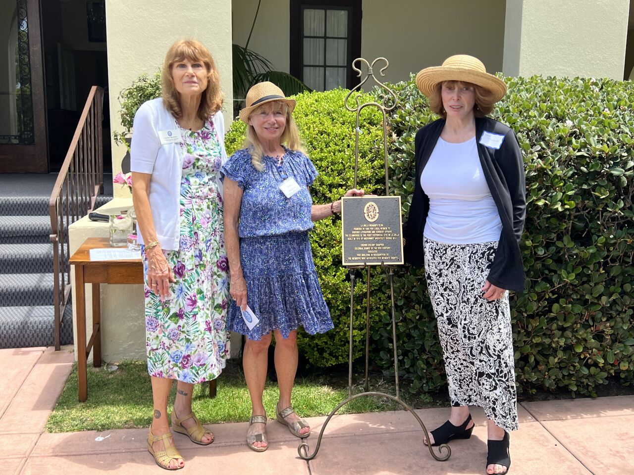 La Jolla Woman's Club President Tona Macken (center) is presented a plaque by Carrie Beinert (left) and Pam Theobald of the Crown Colony chapter of the National Society Colonial Dames XVII Century.
