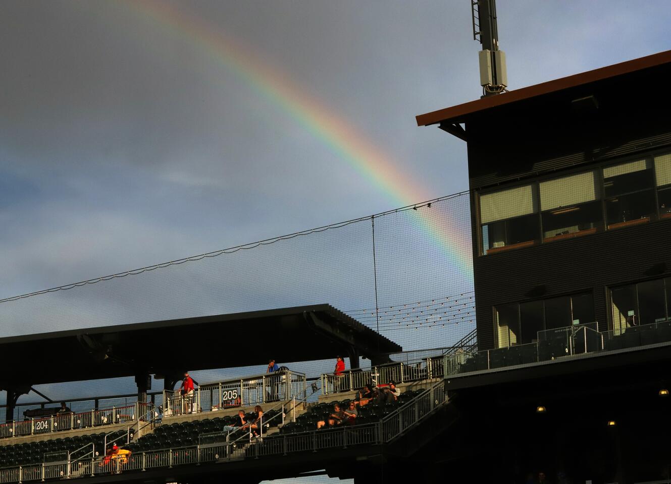 A rainbow appears over the grand stands at Southwest University Park during a minor league baseball game Wednesday, August 7 in El Paso, TX.