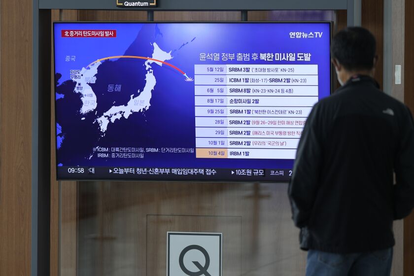 A TV screen showing a news program reporting about North Korea's missile launch, is seen at the Seoul Railway Station in Seoul, South Korea, Tuesday, Oct. 4, 2022. North Korea on Tuesday fired an intermediate-range ballistic missile over Japan for the first time in five years, forcing Japan to issue evacuation notices and suspend trains, as the North escalates tests of weapons designed to strike regional U.S. allies. (AP Photo/Lee Jin-man)