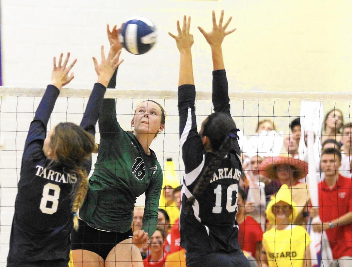 Sage Hill School's Jamie Dailey, center, had 20 kills against St. Margaret's.