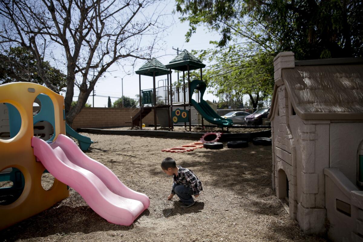 A 3-year-old boy plays in the playground at a preschool of Garden Grove in Garden Grove.