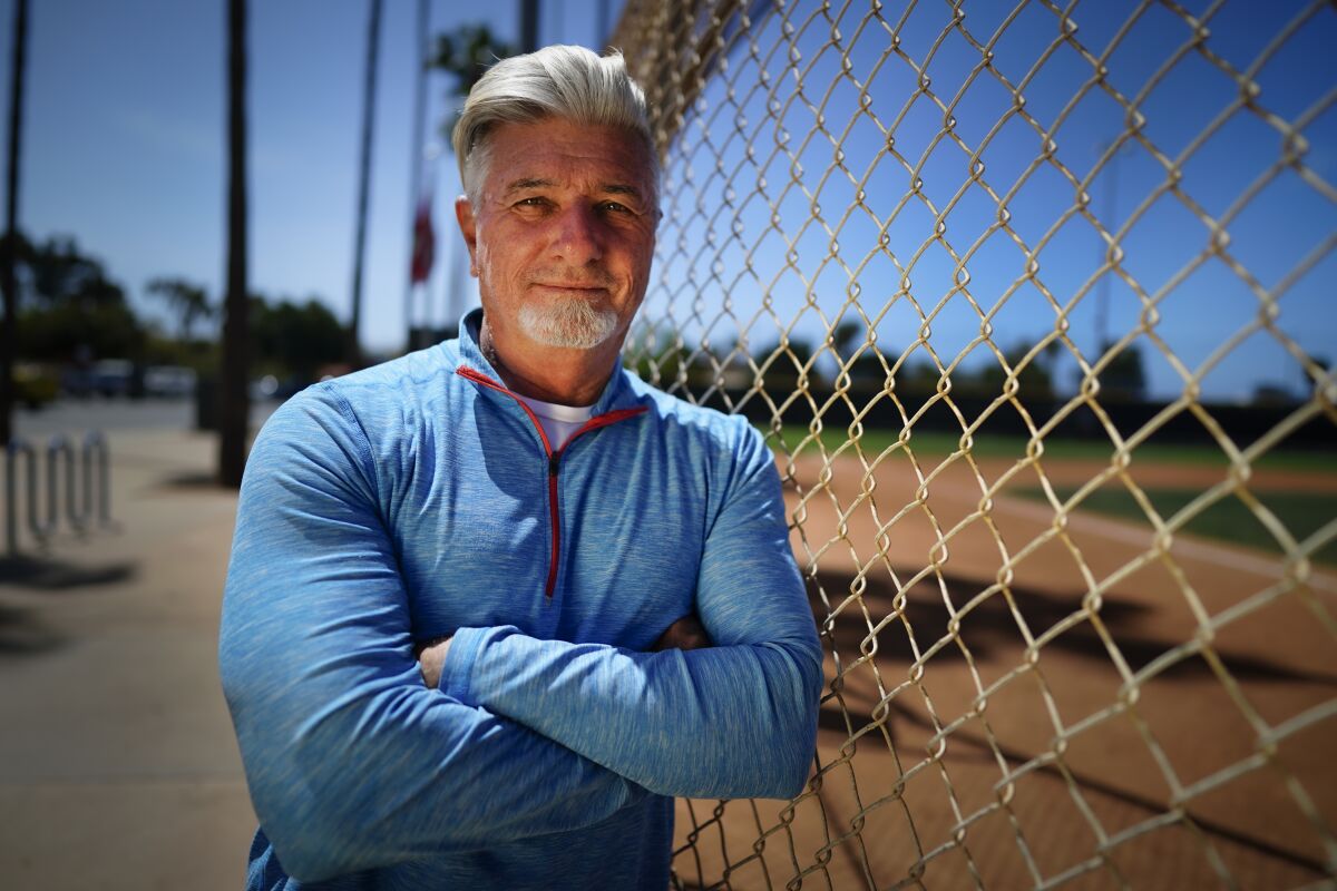 Benny Gallo stands at a baseball field at Paul Ecke Sports Park in Encinitas.