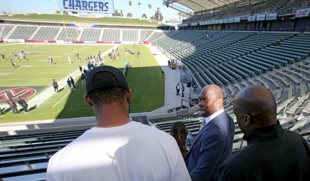 New Chargers Coach Anthony Lynn looks around StubHub Center in Carson following an introductory news conference on Tuesday.