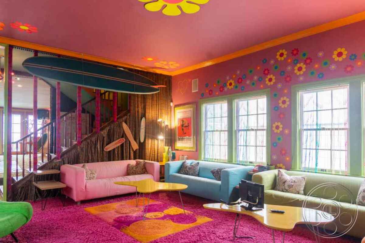 A retro living room with shag carpet and bright colors