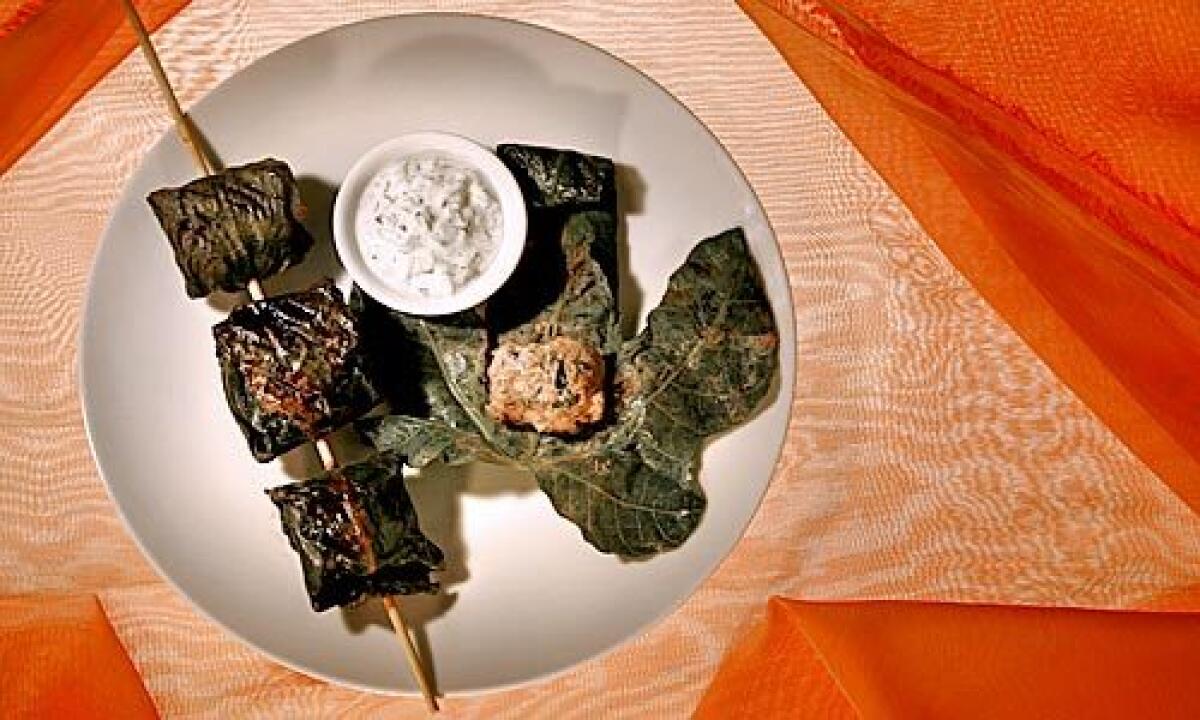 SKEWERED: Fig leaves, with their hints of spice and coconut, are a fragrant wrapper for lamb meatballs.