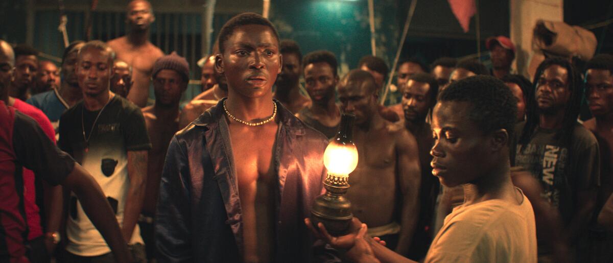 Koné Bakary, center, and Anzian Marcel in "Night of the Kings."