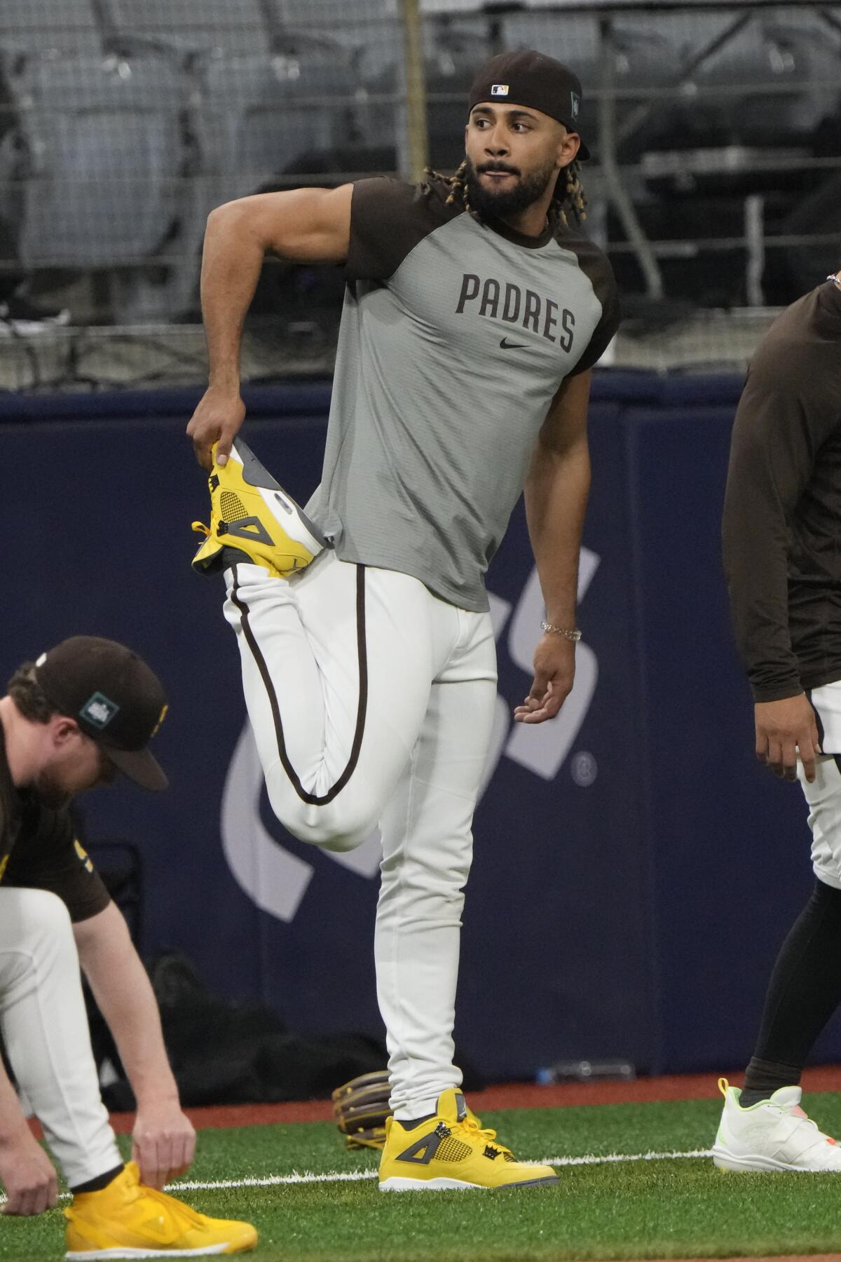 Fernando Tatis Jr. stretches during a workout at the Gocheok Sky Dome 