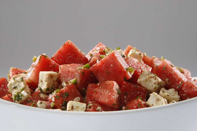 Watermelon salad with feta, mint and cumin-lime dressing.