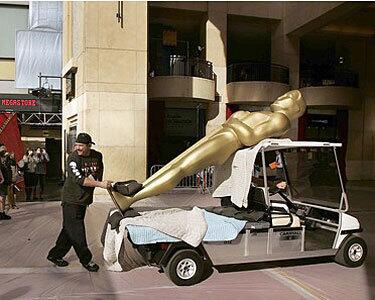 An Oscar statue gets wheeled into the Hollywood and Highland center Friday morning.