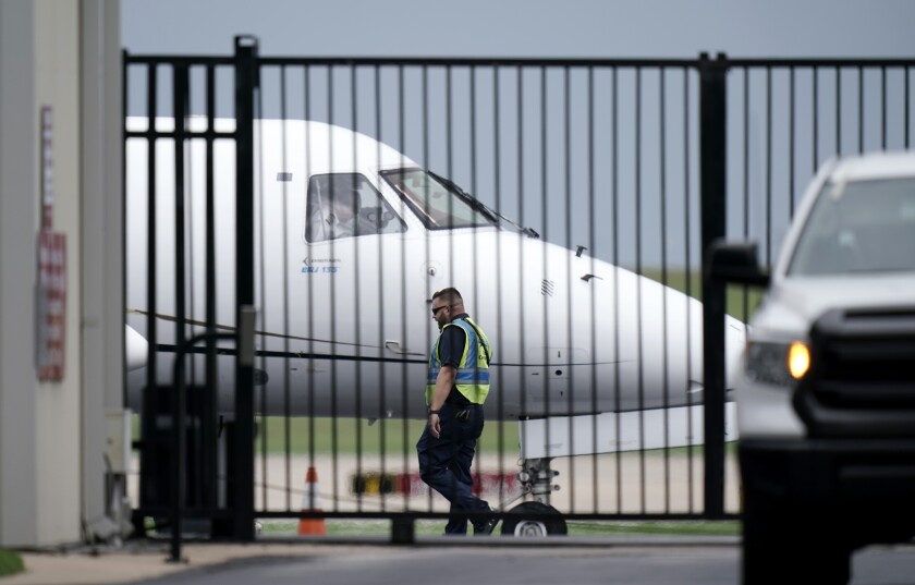 A private plane is readied for Democrats from the Texas Legislature as they arrive by bus to board and head to Washington, D.C., Monday, July 12, 2021, in Austin, Texas. By leaving, Democrats again deny the GOP majority a quorum to pass bills, barely a month after their walkout thwarted the first push for sweeping new voting restrictions in Texas. (AP Photo/Eric Gay)